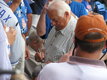 Tom Lasorda signs autograph at Tradition Field