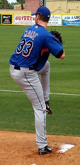 John Maine carrying the ball behind him